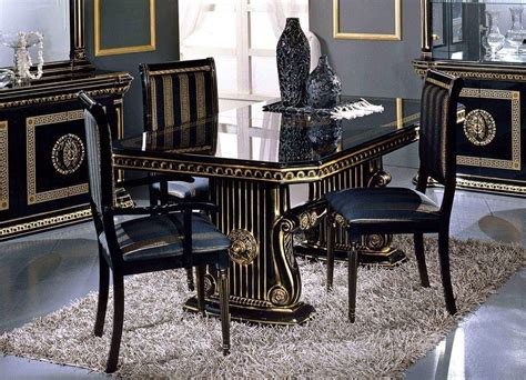 versace black leather sofa|Versace dining table and chairs.